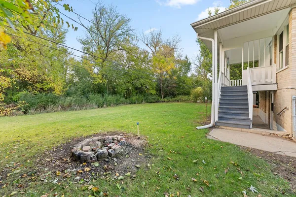a view of a park with large trees