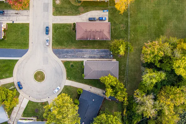 an aerial view of a house with a swimming pool