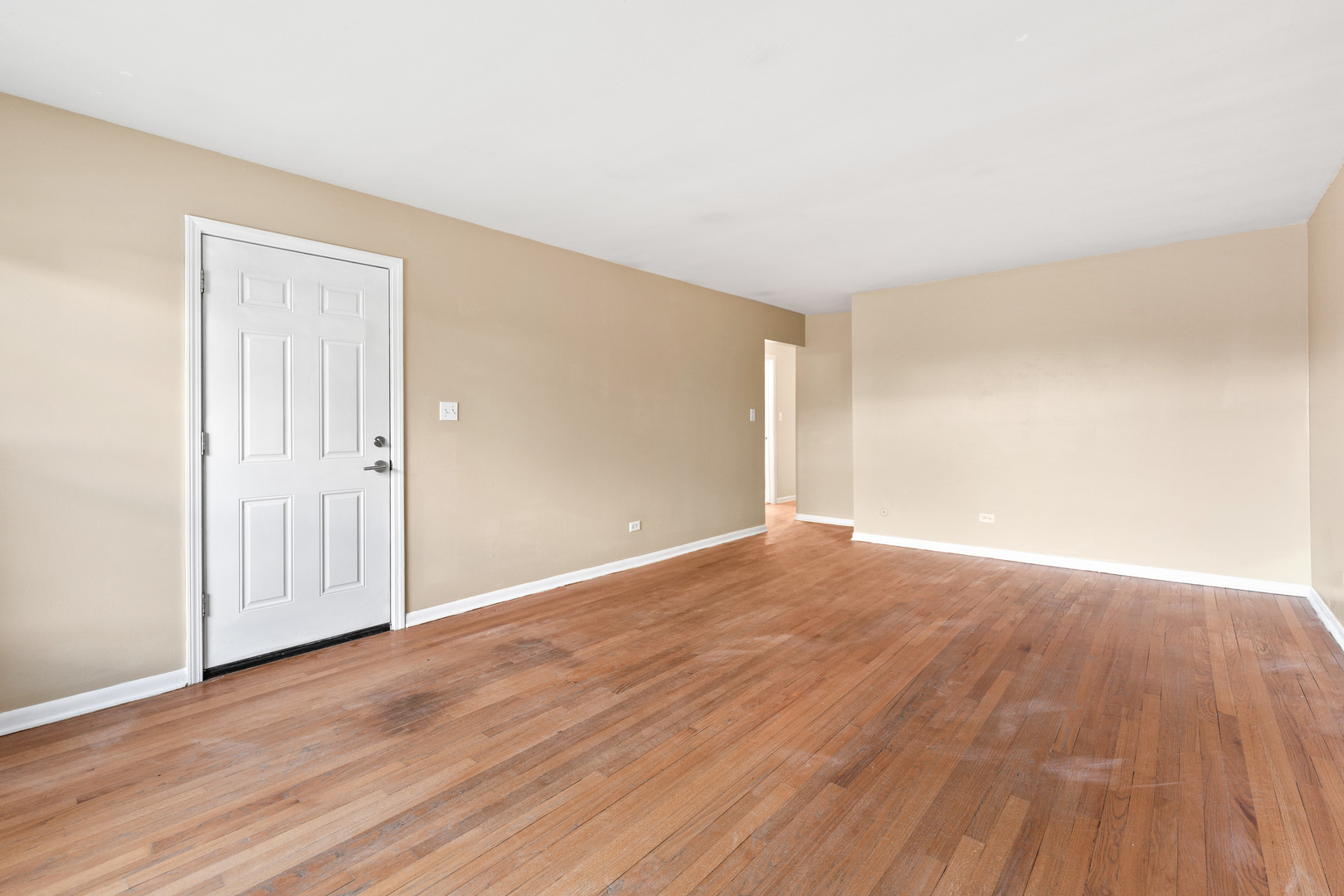 286 Wayne Court, Unit 2 Bartlett, IL 60103 - Photo 8 of 26 a view of an empty room with wooden floor