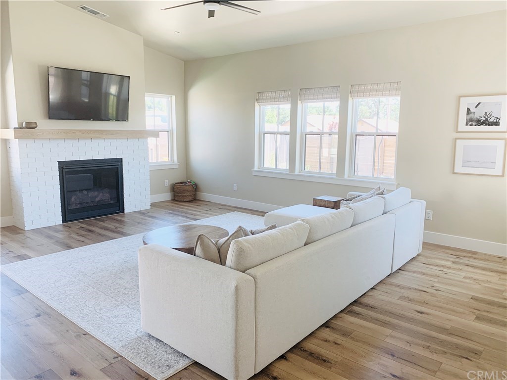 196 Rowan Way Templeton, CA 93465 - Photo 11 of 32 a living room with furniture fireplace and flat screen tv