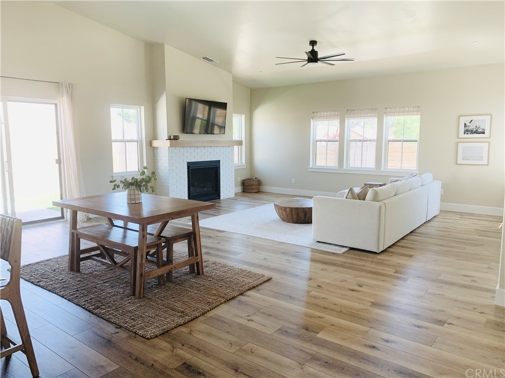 196 Rowan Way Templeton, CA 93465 - Photo 12 of 32 a living room with furniture a fireplace and a table