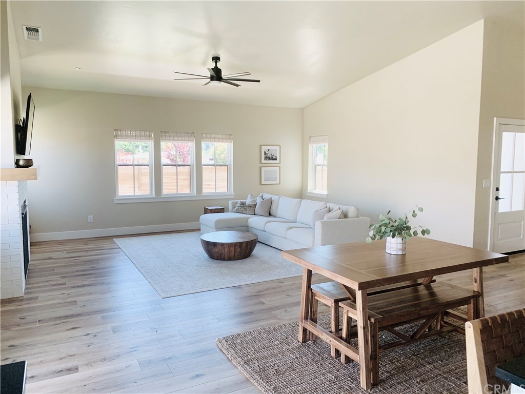 196 Rowan Way Templeton, CA 93465 - Photo 13 of 32 a living room with furniture and a wooden floor