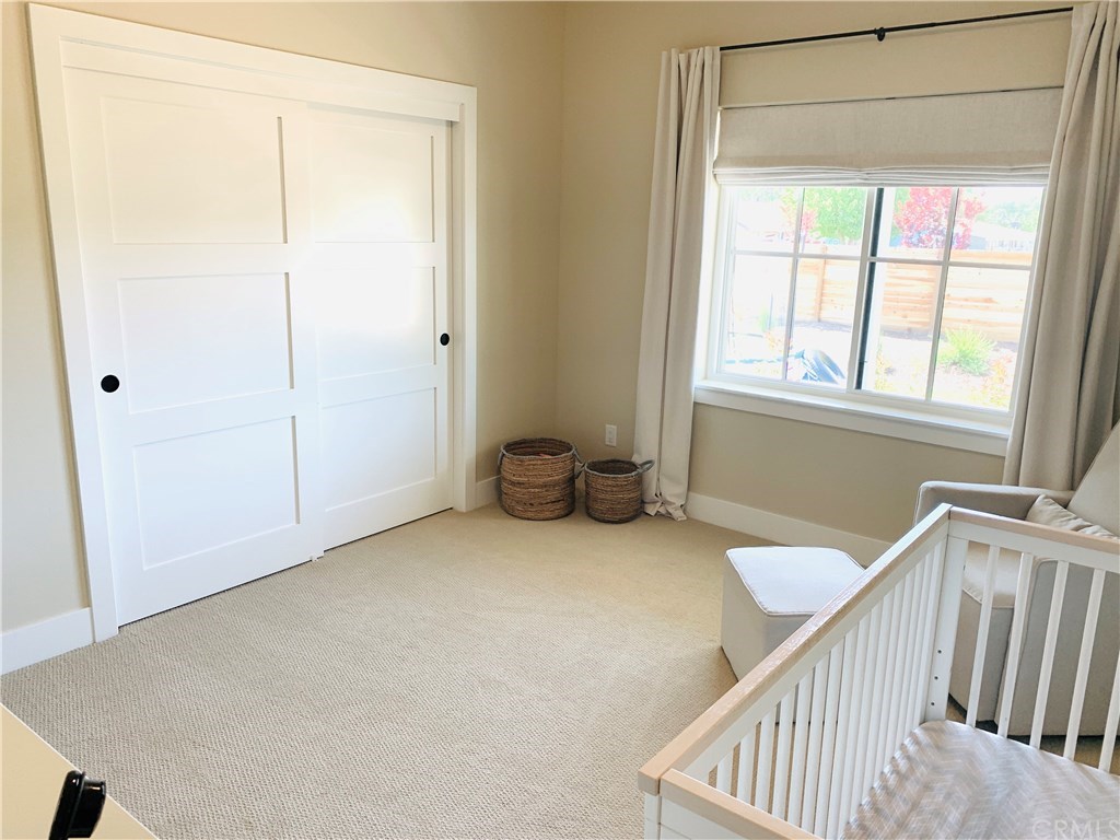 196 Rowan Way Templeton, CA 93465 - Photo 20 of 32 a view of a room with wooden floor and windows