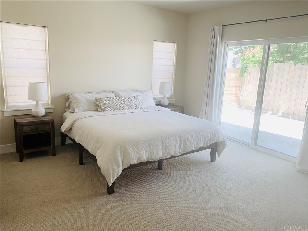 196 Rowan Way Templeton, CA 93465 - Photo 26 of 32 a large bed sitting in a bedroom next to a window