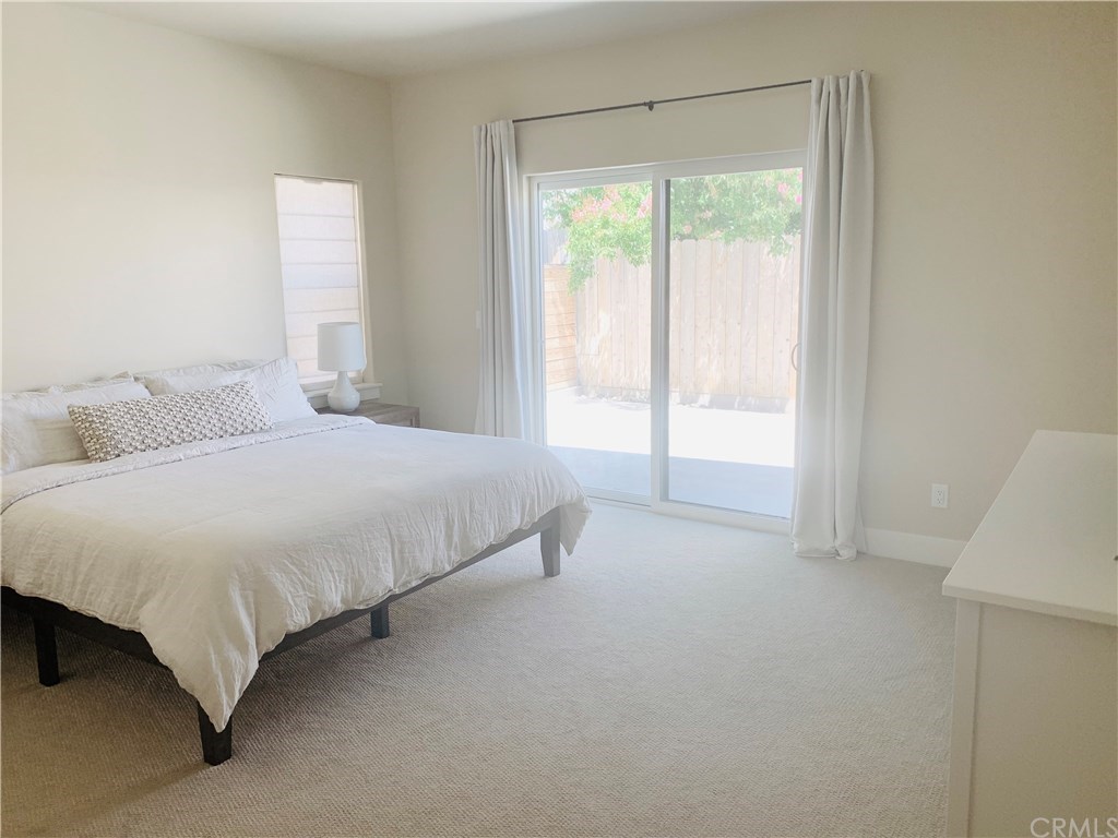 196 Rowan Way Templeton, CA 93465 - Photo 28 of 32 a bedroom with a bed and a window