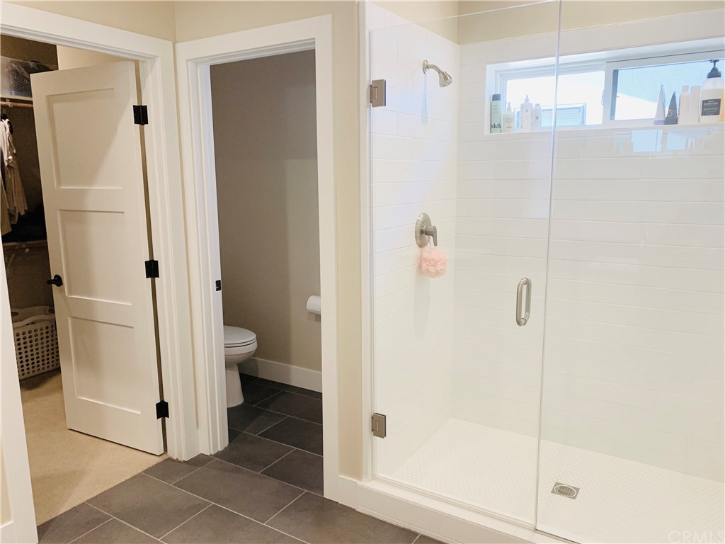 196 Rowan Way Templeton, CA 93465 - Photo 30 of 32 a bathroom with a shower and a toilet