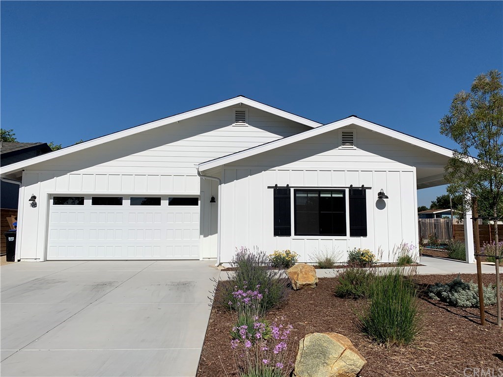 196 Rowan Way Templeton, CA 93465 - Photo 3 of 32 a front view of a house with a garage