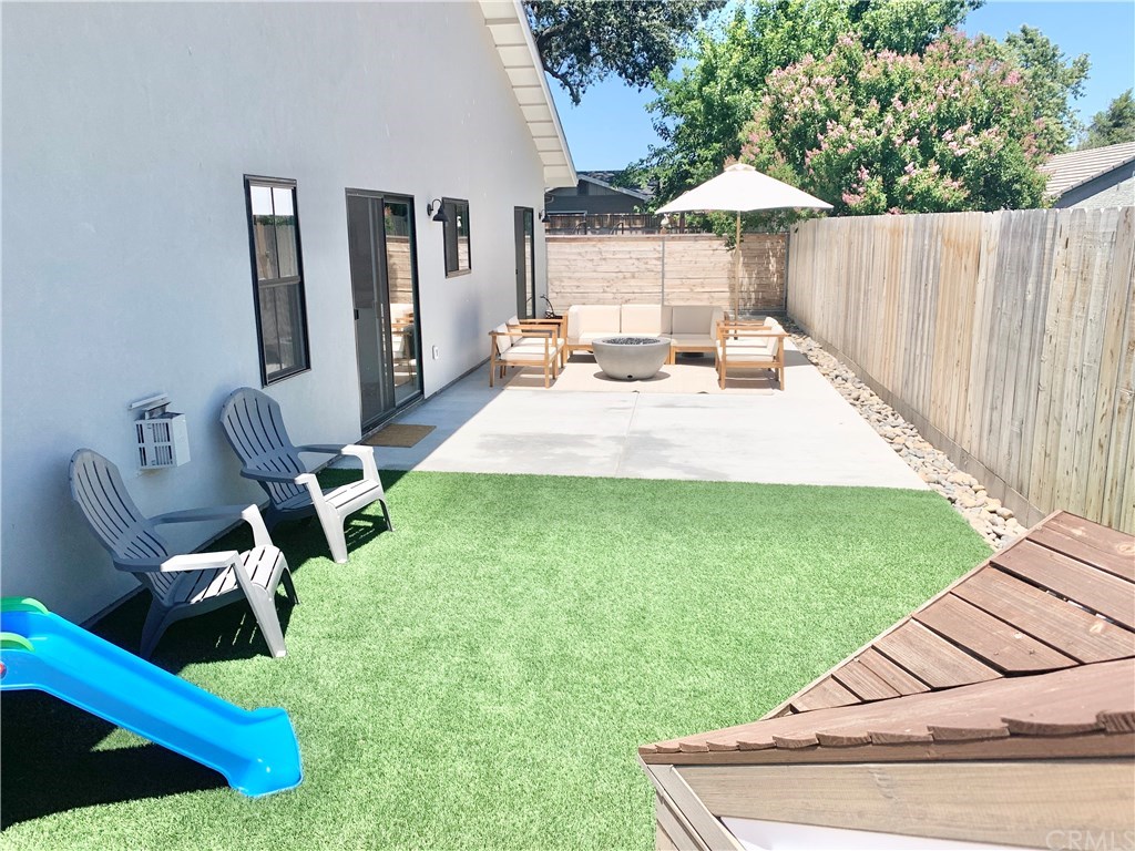 196 Rowan Way Templeton, CA 93465 - Photo 32 of 32 a view of a backyard with furniture and a slide