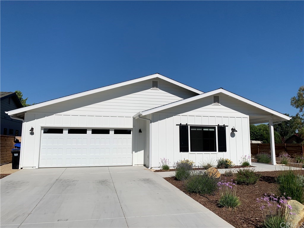 196 Rowan Way Templeton, CA 93465 - Photo 4 of 32 a front view of a house with garage