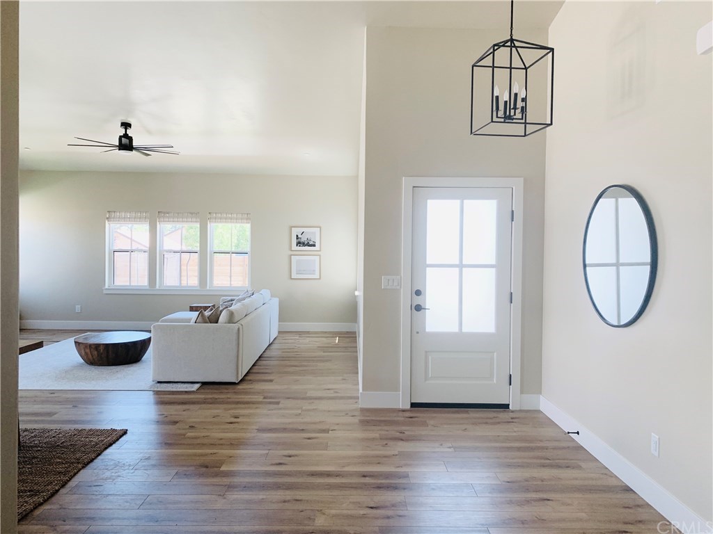 196 Rowan Way Templeton, CA 93465 - Photo 10 of 32 wooden floor in an empty room with a window
