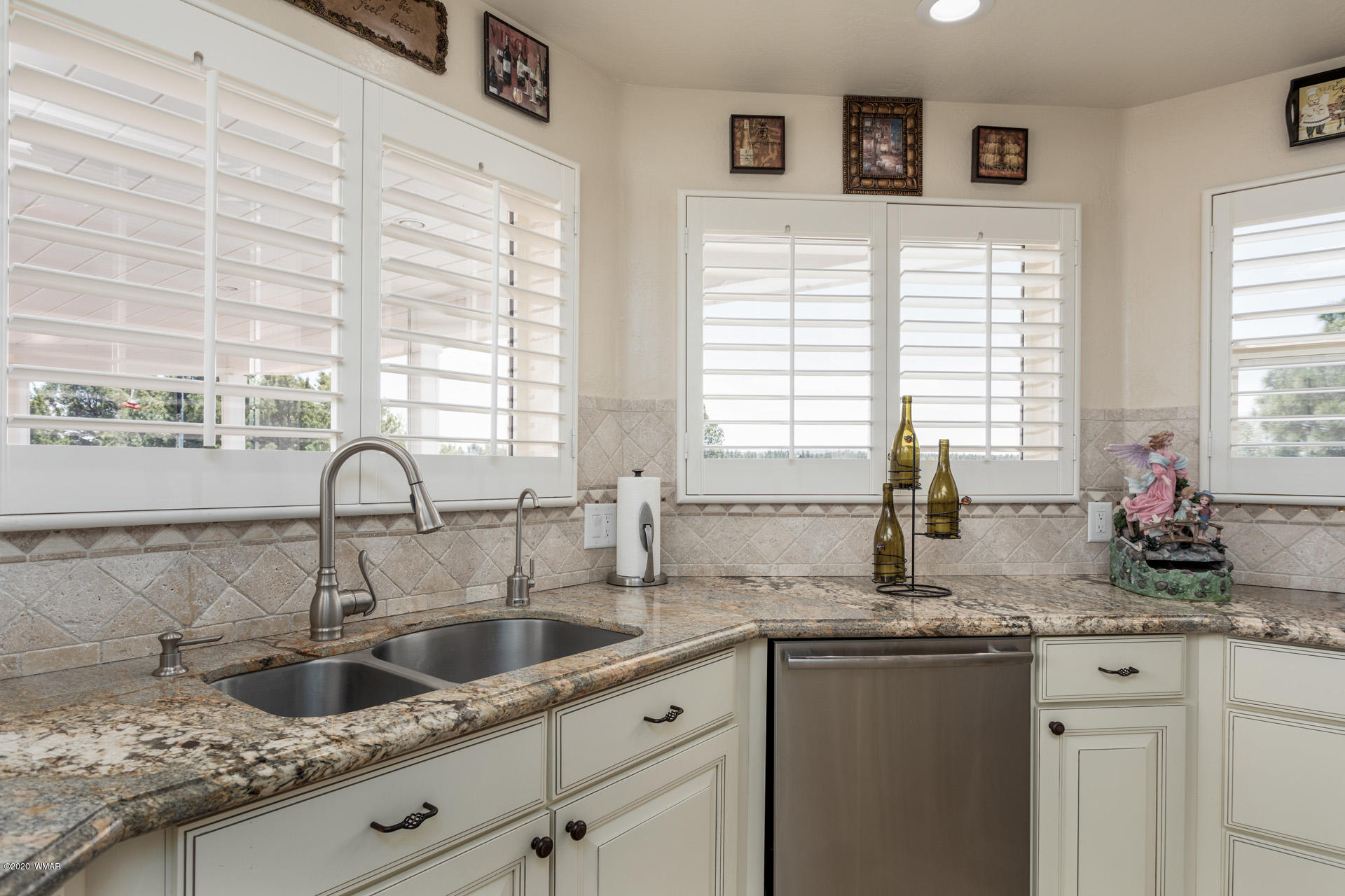 2974 Ranch House Road Overgaard, AZ 85933 - Photo 23 of 46 a kitchen with sink a window and cabinets