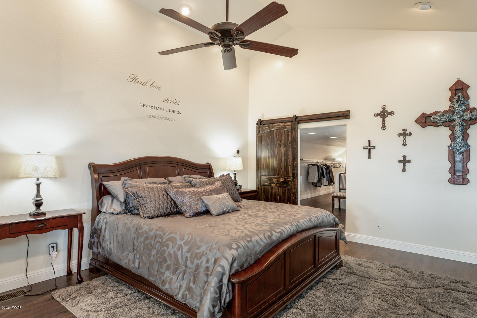 2974 Ranch House Road Overgaard, AZ 85933 - Photo 35 of 46 a bedroom with a bed and a chandelier