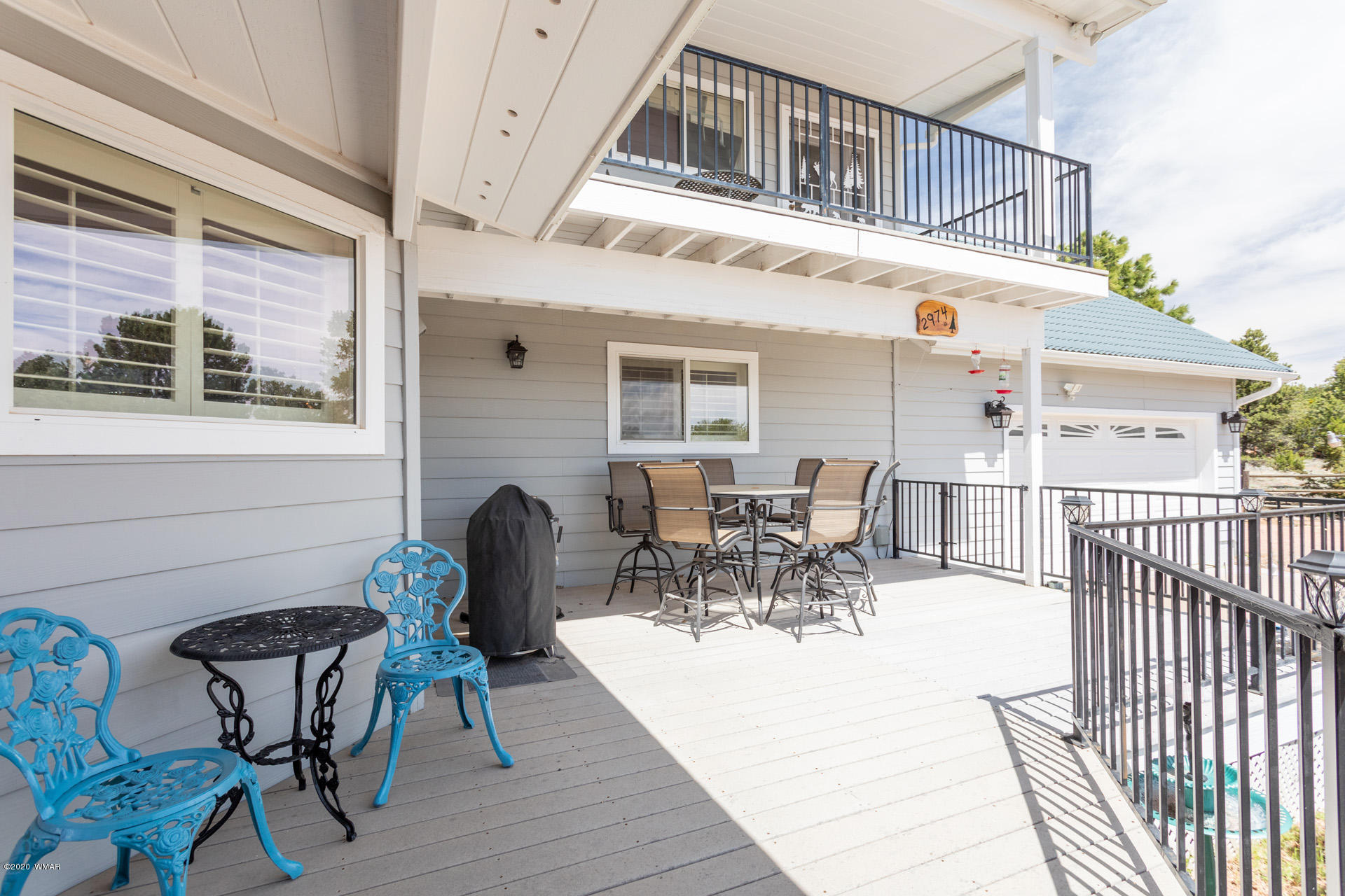2974 Ranch House Road Overgaard, AZ 85933 - Photo 6 of 46 a view of a patio with table and chairs and wooden floor