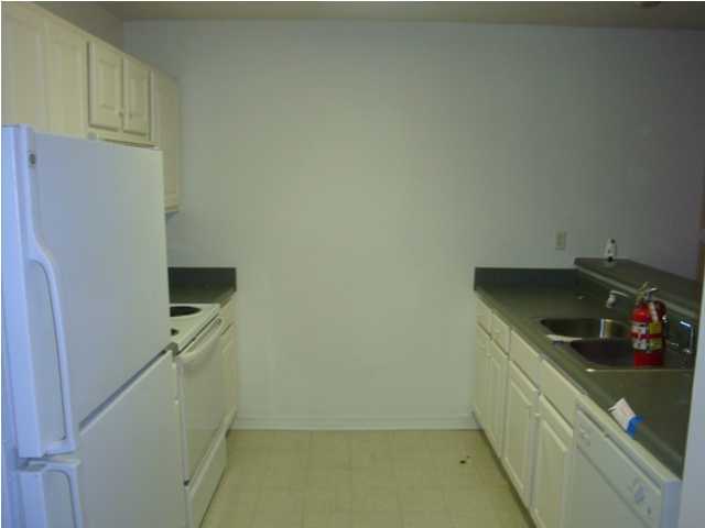 514 Keystone Road, Unit 514 Mary Esther, FL 32569 - Photo 3 of 10 a kitchen with a sink and cabinets