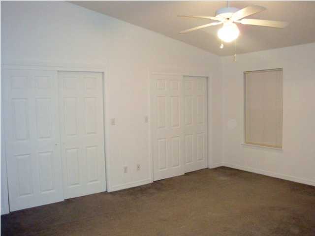 514 Keystone Road, Unit 514 Mary Esther, FL 32569 - Photo 5 of 10 an empty room with a fan & a window