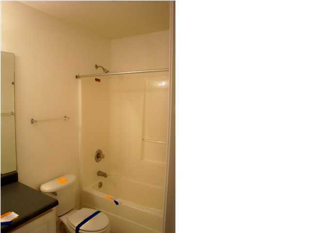 514 Keystone Road, Unit 514 Mary Esther, FL 32569 - Photo 6 of 10 a bathroom with a granite countertop shower and a toilet