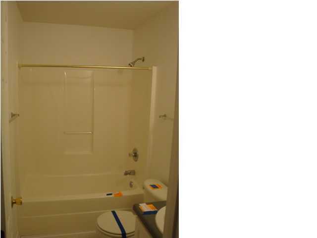 514 Keystone Road, Unit 514 Mary Esther, FL 32569 - Photo 8 of 10 a bathroom with a shower