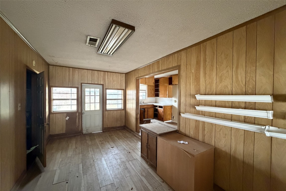 3207 Washington Street Pasadena, TX 77503 - Photo 5 of 9 a view of room with stairs and wooden floor
