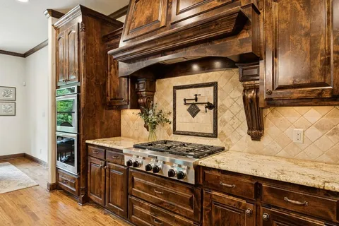 a kitchen with a sink and chandelier