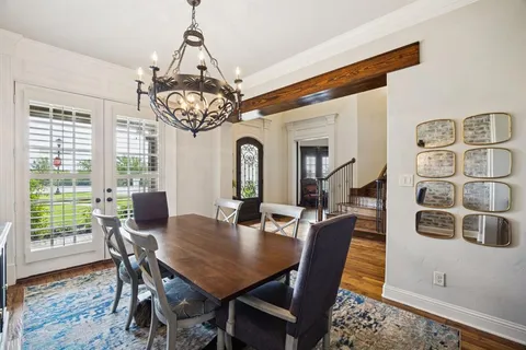 a view of a house with swimming pool and sitting area