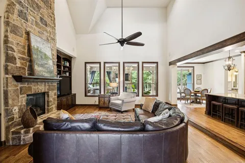 a living room with furniture ceiling fan and a rug
