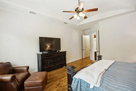 a bed room with a bed and a chandelier