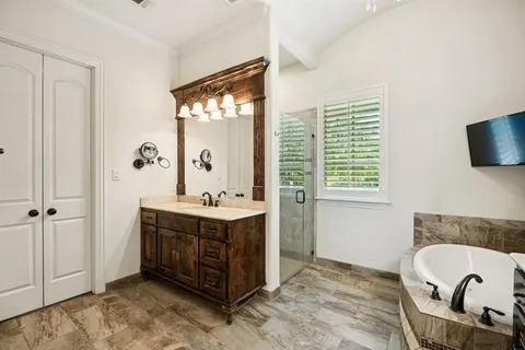 a bathroom with a sink double vanity and a mirror