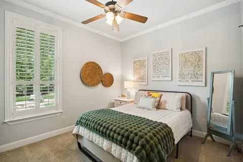 a bedroom with a bed and a table in it