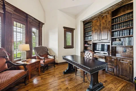 a work room with furniture and windows