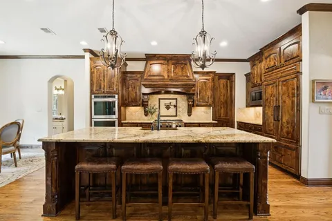 a open kitchen with stainless steel appliances granite countertop a sink and cabinets