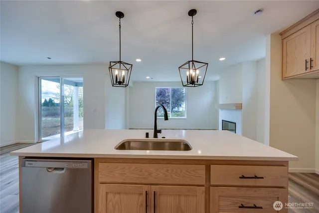 a kitchen with sink and window
