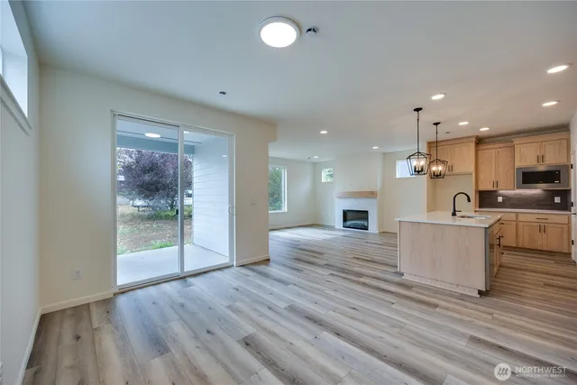 a view of kitchen with cabinets and wooden floor