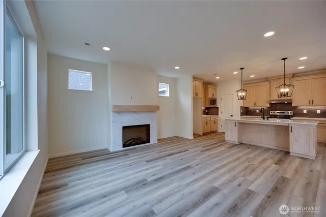 a view of kitchen with cabinets and wooden floor