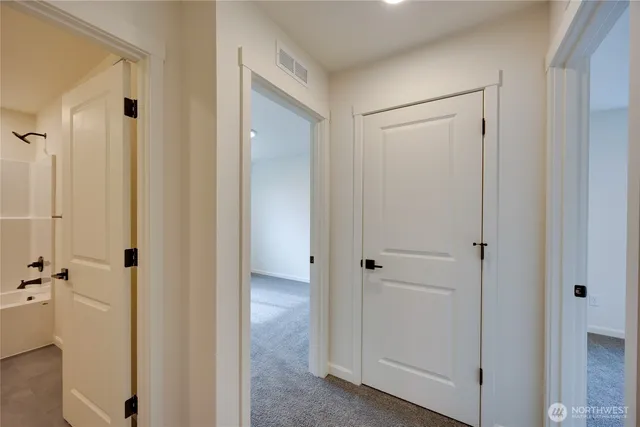 a view of a bathroom with a glass door
