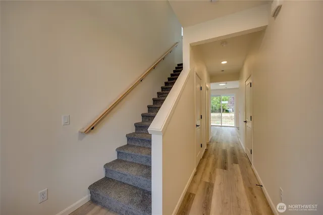 a view of entryway with wooden floor