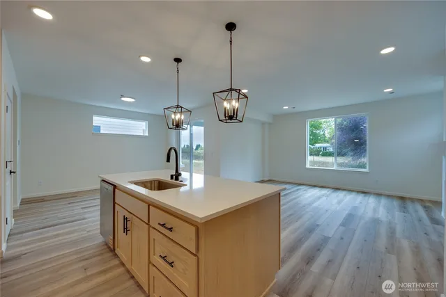 a kitchen with a sink and window