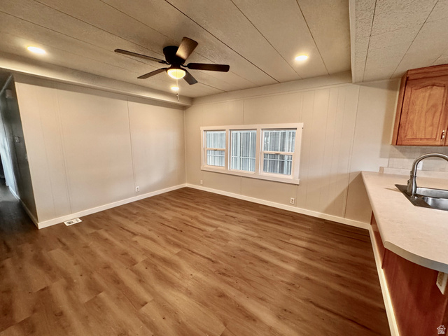 158 Cushing Way Layton, UT 84041 - Photo 6 of 14 Open concept living area featuring wood-finish flooring, a ceiling fan with integrated lighting, recessed lighting, and a window with white trim