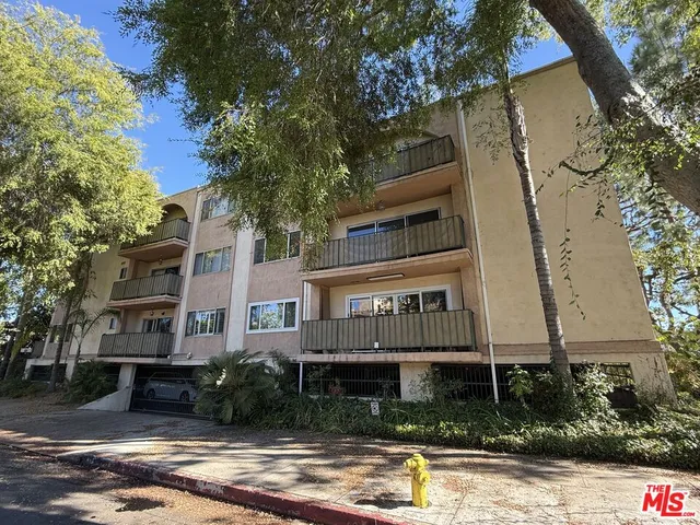 a front view of a building with street view
