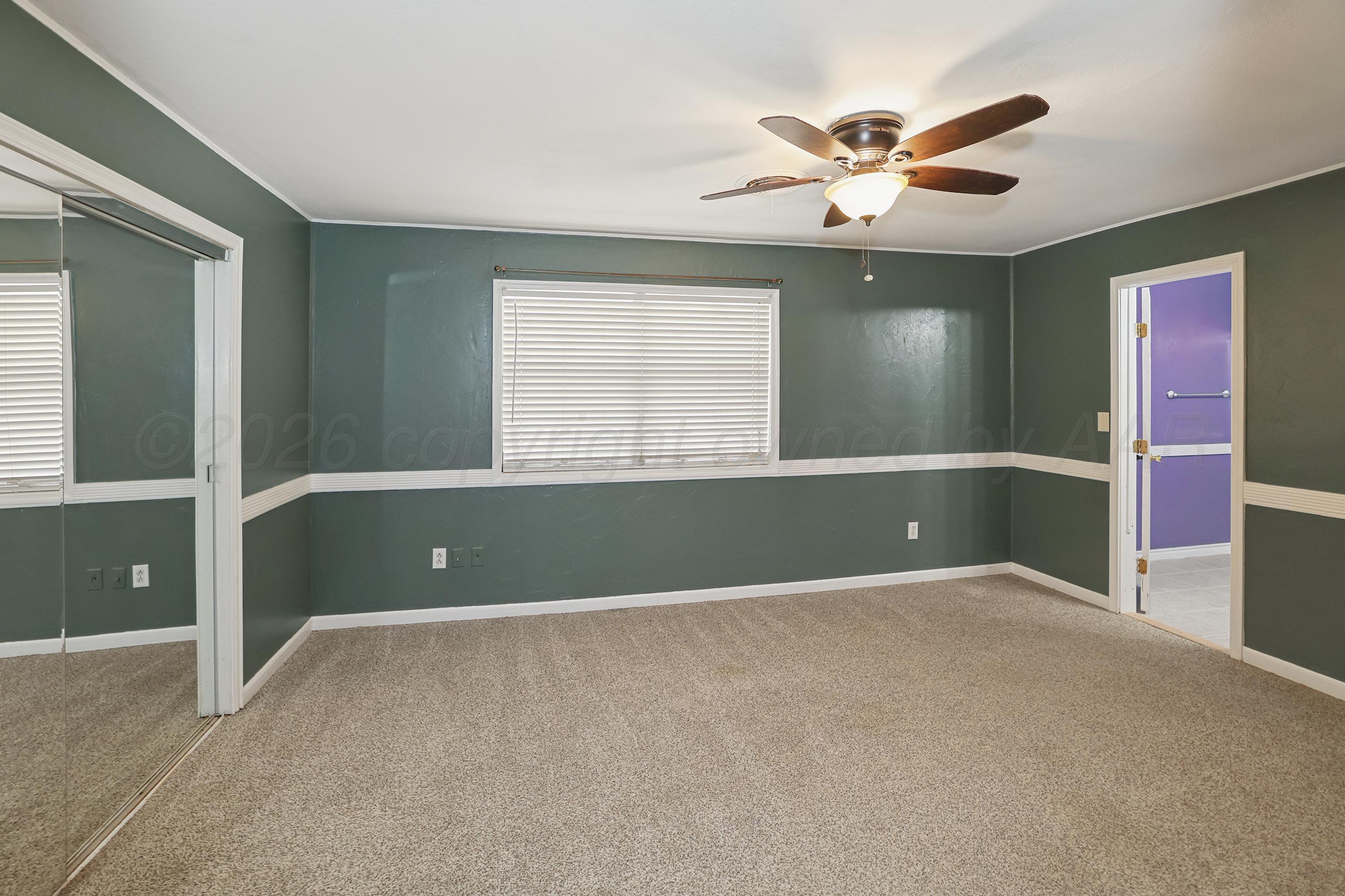 14200 Savannah Road Amarillo, TX 79118 - Photo 11 of 34 a view of an empty room with a window