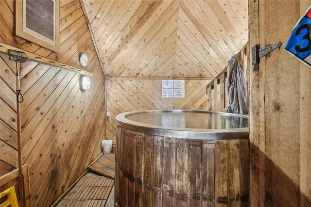 a bedroom with a large bed and a couch