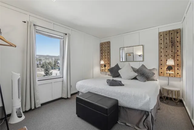 a bedroom with a bed and furniture