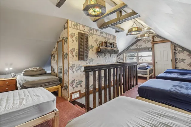 a living room with furniture fireplace and rug