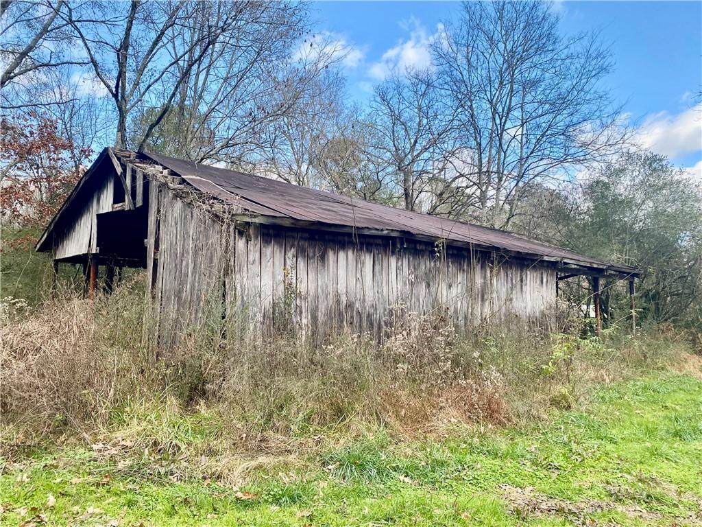 0 Little Texas Valley Road Northwest Rome, GA 30165 - Photo 5 of 12 a backyard of a house with lots of green space and wooden fence