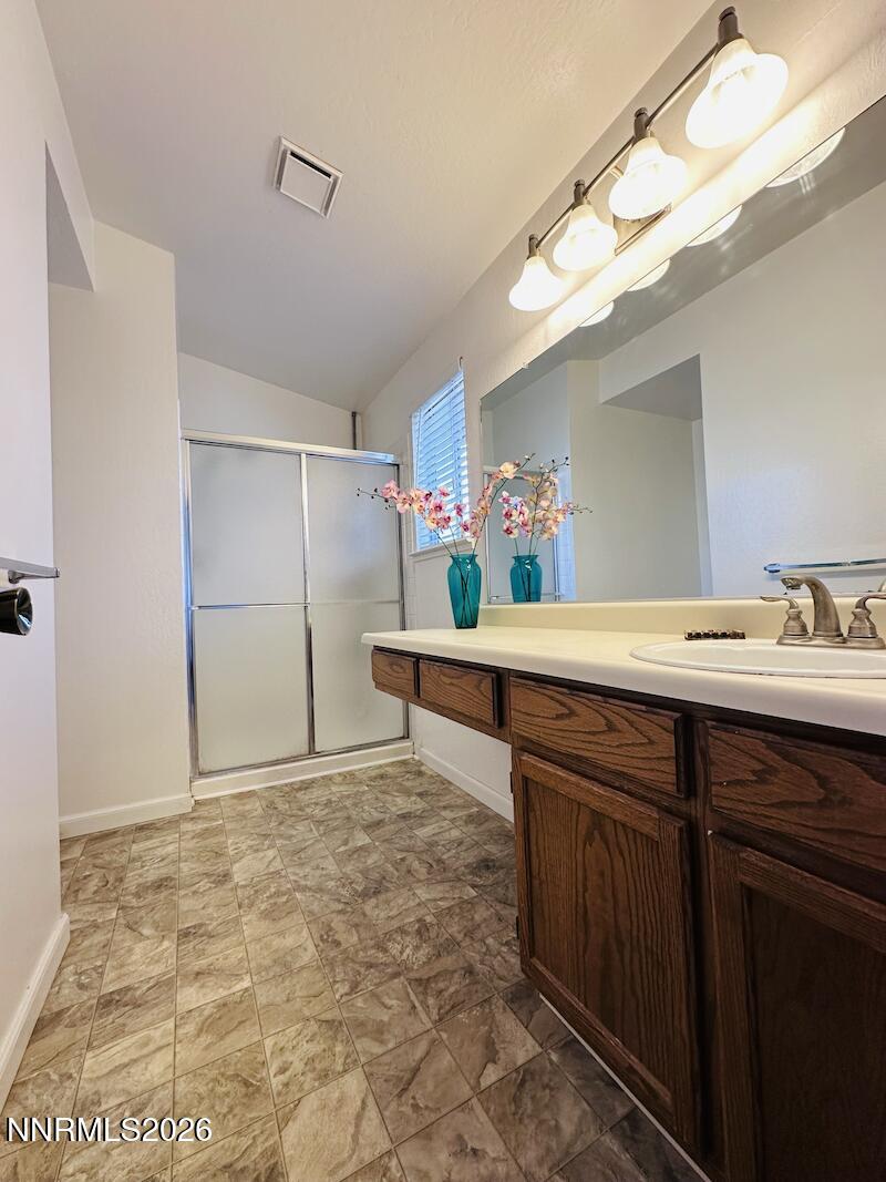 1182 Blue Lakes Road Reno, NV 89523 - Photo 13 of 31 a bathroom with a sink and a mirror
