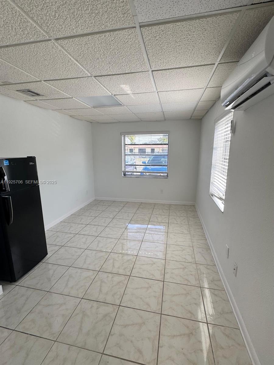 a view of an empty room and window