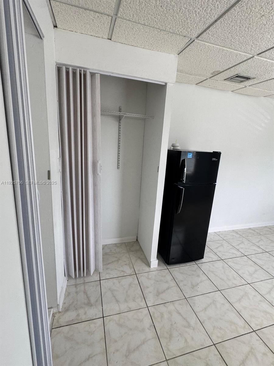 14281 Southwest 285th Street Homestead, FL 33033 - Photo 2 of 6 a view of a utility room with cabinet