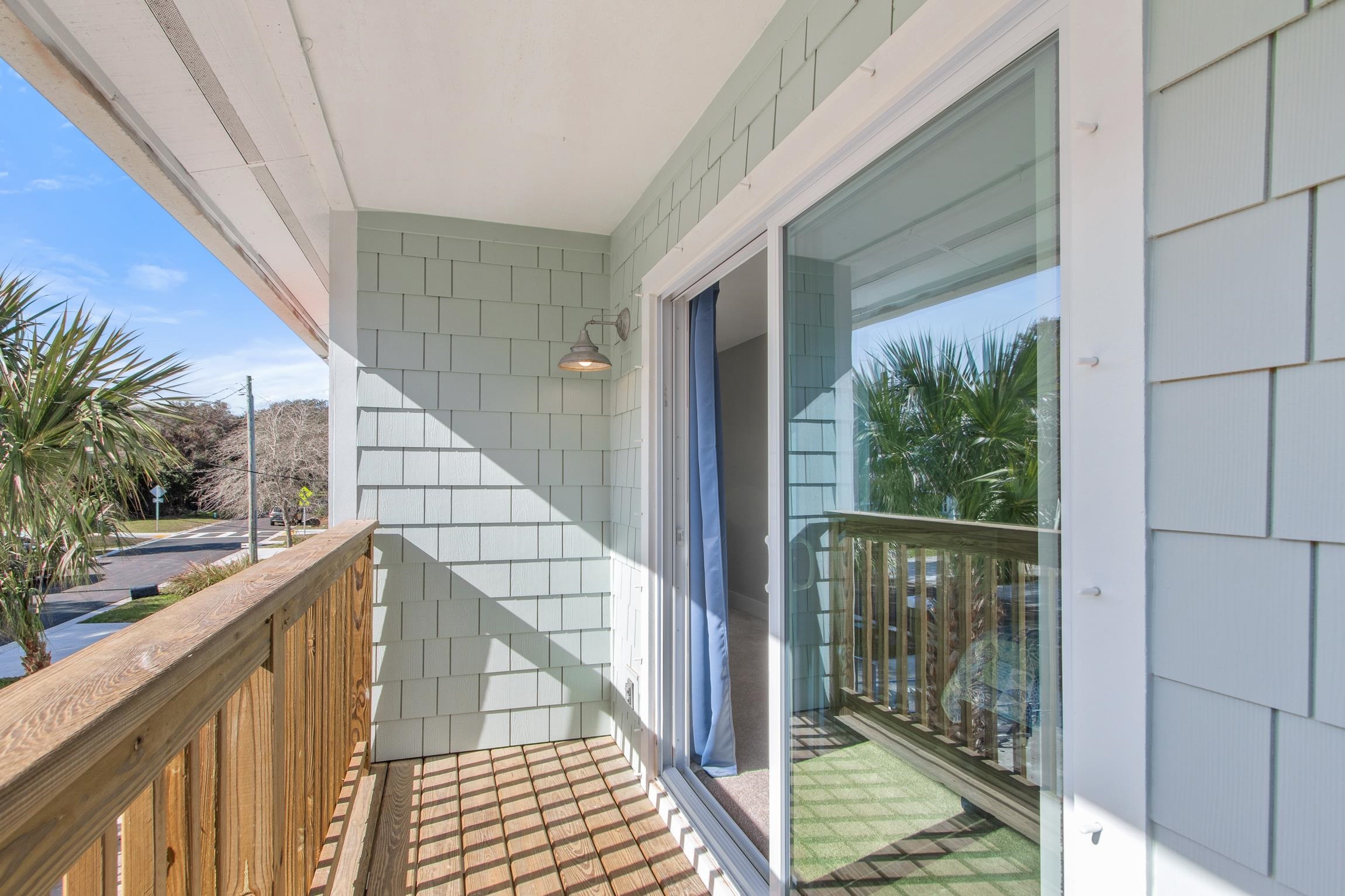 112 2nd Street St. Augustine, FL 32080 - Photo 25 of 49 a view of balcony with wooden floor and fence