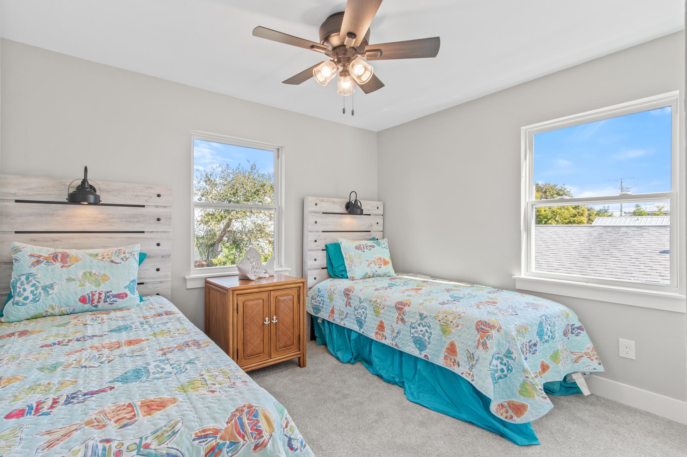 112 2nd Street St. Augustine, FL 32080 - Photo 29 of 49 a bedroom with a bed and a chandelier