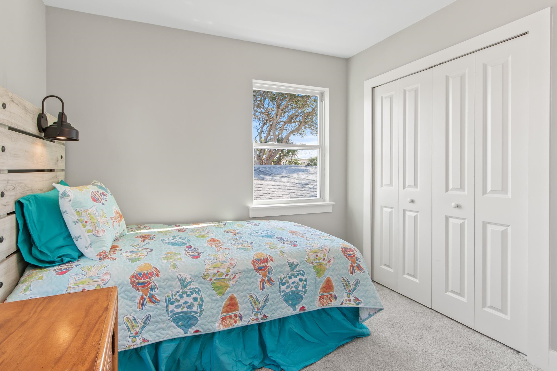 112 2nd Street St. Augustine, FL 32080 - Photo 30 of 49 a bedroom with a bed and a window