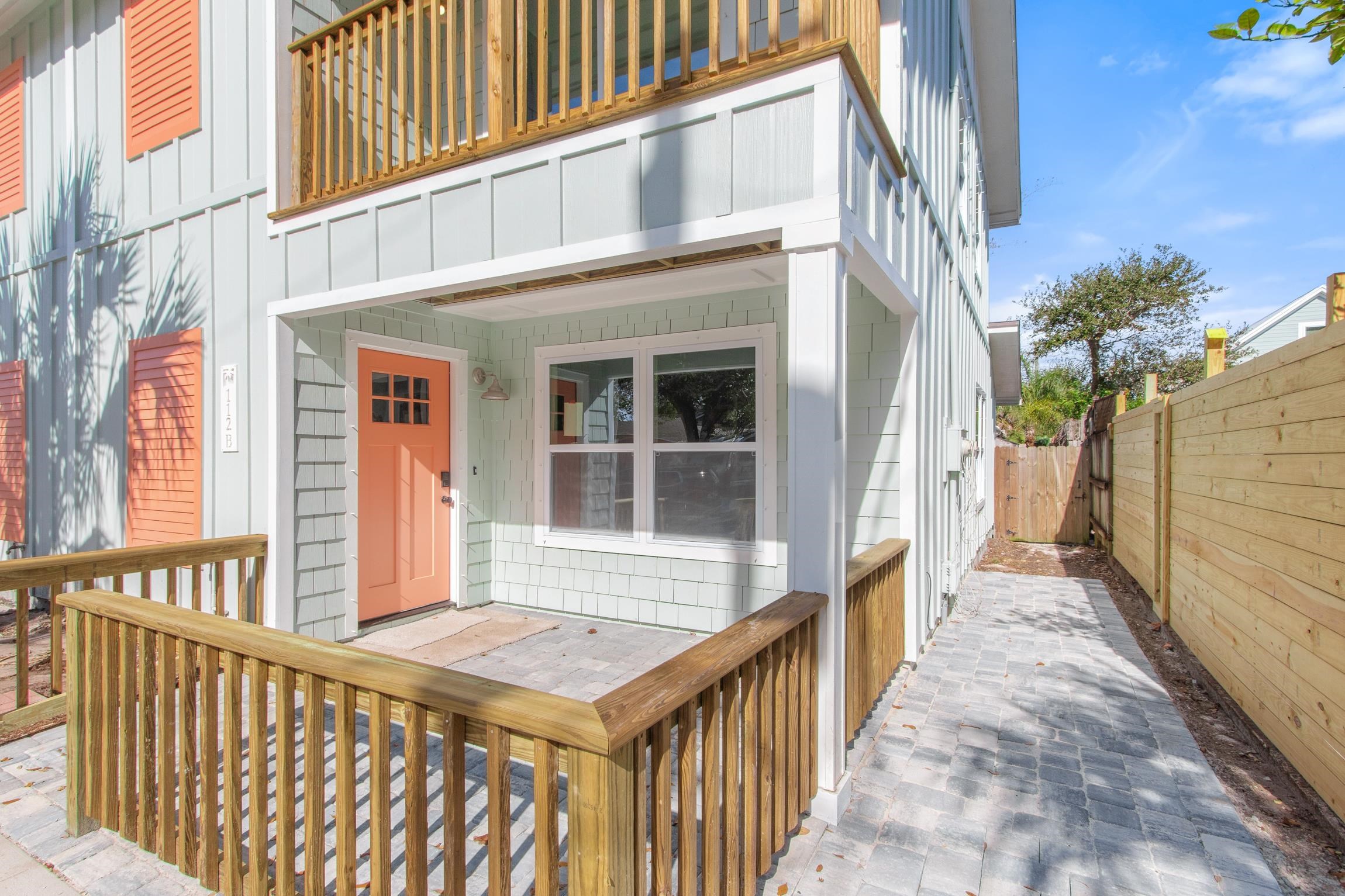 112 2nd Street St. Augustine, FL 32080 - Photo 48 of 49 a view of a brick house with a wooden fence